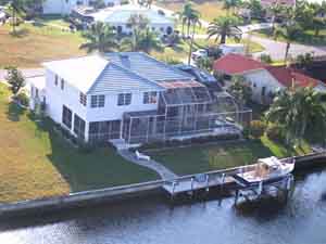 Home on the water with a dock and a lift.